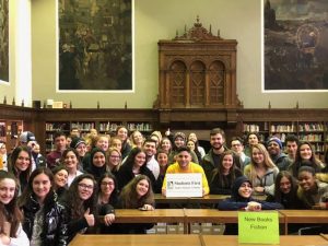 A large group of students from Fordson and Seaholm high schools holding the Dearborn vision sign. 