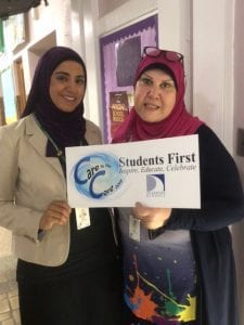 Assistant Principal, Ms. Ahmed , and Parent Liaison, Ms. Dakroub posing with the Care to the Core sign